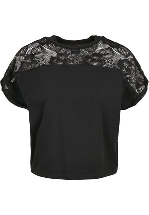 T-shirt noir avec un design en dentelle texturée sur les épaulettes, à manches courtes et coupe décontractée. Matière en coton douce.
