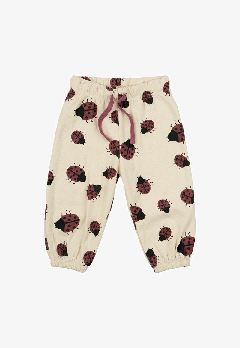 Gyerek nadrág puha bézs szövetből, piros és fekete katicabogár mintával. Rugalmas derékrésszel és ráncolt mandzsettákkal rendelkezik.