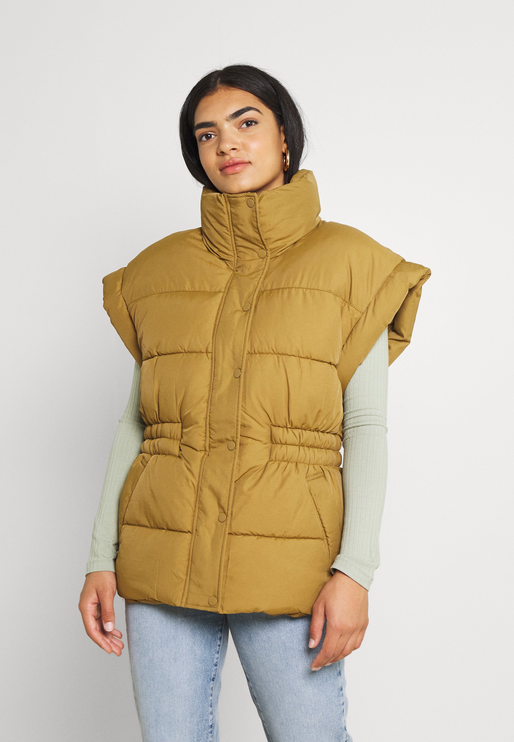 brown puffer vest