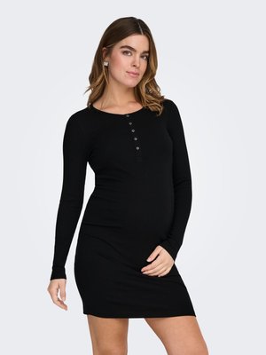 Svart langermet kjole laget av ribbestrikket stoff, med rund hals og knappestolpe foran. Figursydd fasong fremhever silhuetten.