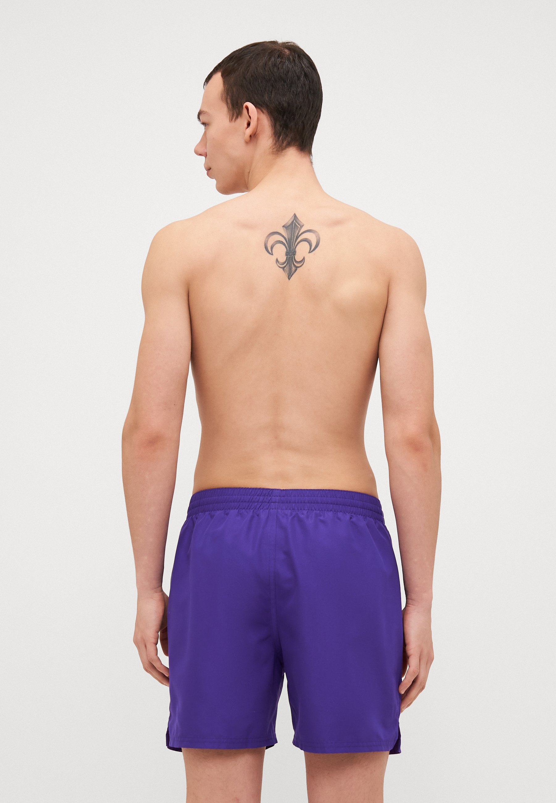 purple nike swim trunks