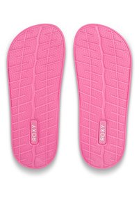 Pink rubber insoles featuring a textured grip pattern and a center logo label. The design includes curved edges for comfort.