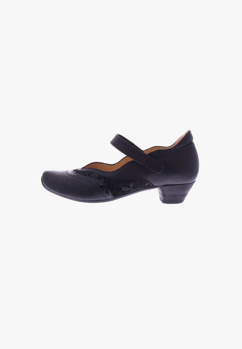 Black leather Mary Jane-style shoe with a rounded toe, low stacked heel, floral detailing on the side, and adjustable strap.