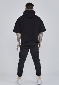 SIKSILK CUT OFF - Tričko s potlačou - black