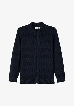 Pull zippé en maille bleu marine avec rayures horizontales texturées, col, poignets et bas côtelés, présenté à plat sur fond blanc.