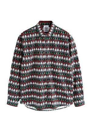 Svart långärmad skjorta med ett upprepat mönster av vita figurer med tomteluva, gröna träd, polkagrisar och röda detaljer.