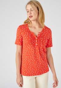 Damart COL TUNISIEN - Camiseta estampada - orange imp. pois