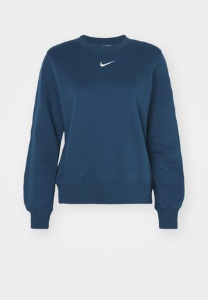 Sudadera azul marino de suave mezcla de algodón, con cuello redondo, mangas largas, puños acanalados y un pequeño logo blanco de Nike en el pecho.