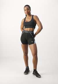 Puma FIT TRAIN STRONG SHORT - Leggingek - black
