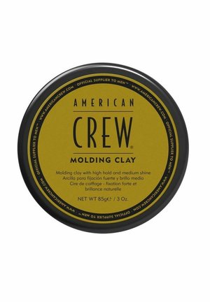 American Crew Molding Clay hårproduktbeholder med sort låg og gul etiket, 85 g, der giver kraftigt hold og medium glans.