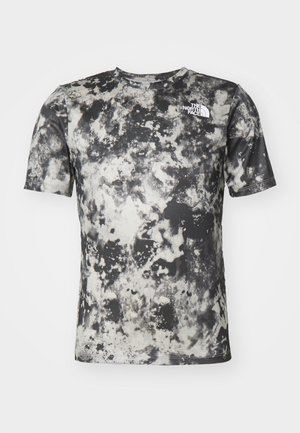Koszulka z krótkim rękawem i okrągłym dekoltem z czarno-białym abstrakcyjnym wzorem tie-dye oraz białym logo The North Face na piersi.