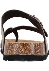 Braun korkkonstruktierte Sandale mit verstellbaren Riemen, einer strukturierten Innensohle und einer schwarzen Gummisohle, die ein minimalistisches Design ohne Verzierungen aufweist.