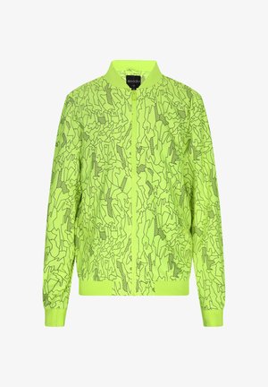 Neon grøn bomberjakke med et geometrisk sort mønster, frontlynlås, ståkrave og elastiske manchetter og forneden.