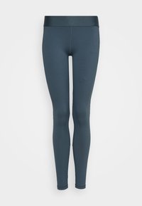 Obcisłe legginsy w ciemnym odcieniu teal. Wykonane z elastycznego materiału, mają gładką talię bez dodatkowych wzorów czy akcentów.