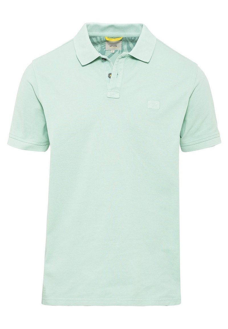 Polo shirt verde chiaro in cotone, con colletto classico, patta con due bottoni e un piccolo logo sul petto. Maniche corte.