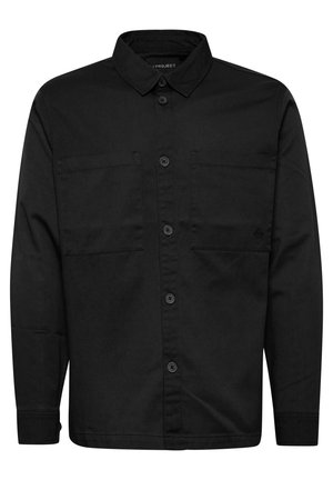 Black long-sleeve shirt made of cotton, featuring a button-down collar, two chest pockets, and a subtle logo on the left pocket area.