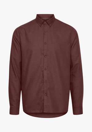 Burgunderfarget skjorte med knappestolpe og lange ermer, spiss krage og brune knapper. Laget av strukturert stoff med buet skjortekant.