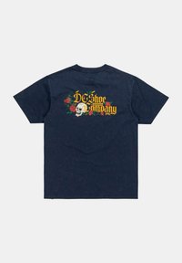 Navy blue cotton t-shirt with a relaxed fit. Features a skull graphic surrounded by roses and "DC Shoe Company" lettering in yellow.