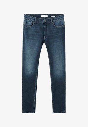 Tmavomodré rifľové nohavice s úzkym strihom. Majú päť vreciek, pútka na opasok a klasické zapínanie na gombík. Mierne vyblednutá textúra.