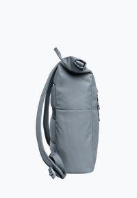 Gray backpack made of durable fabric, featuring a roll-top design, adjustable straps, and a side pocket for storage. Textured finish.