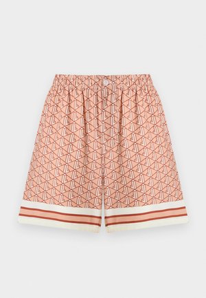 Korangitud ujumispüksid virsiku värvi, millel on kõikjal geomeetriline muster. Veniv vöökoht, millel on nupp ja kontrastne triibuline ääre detail.