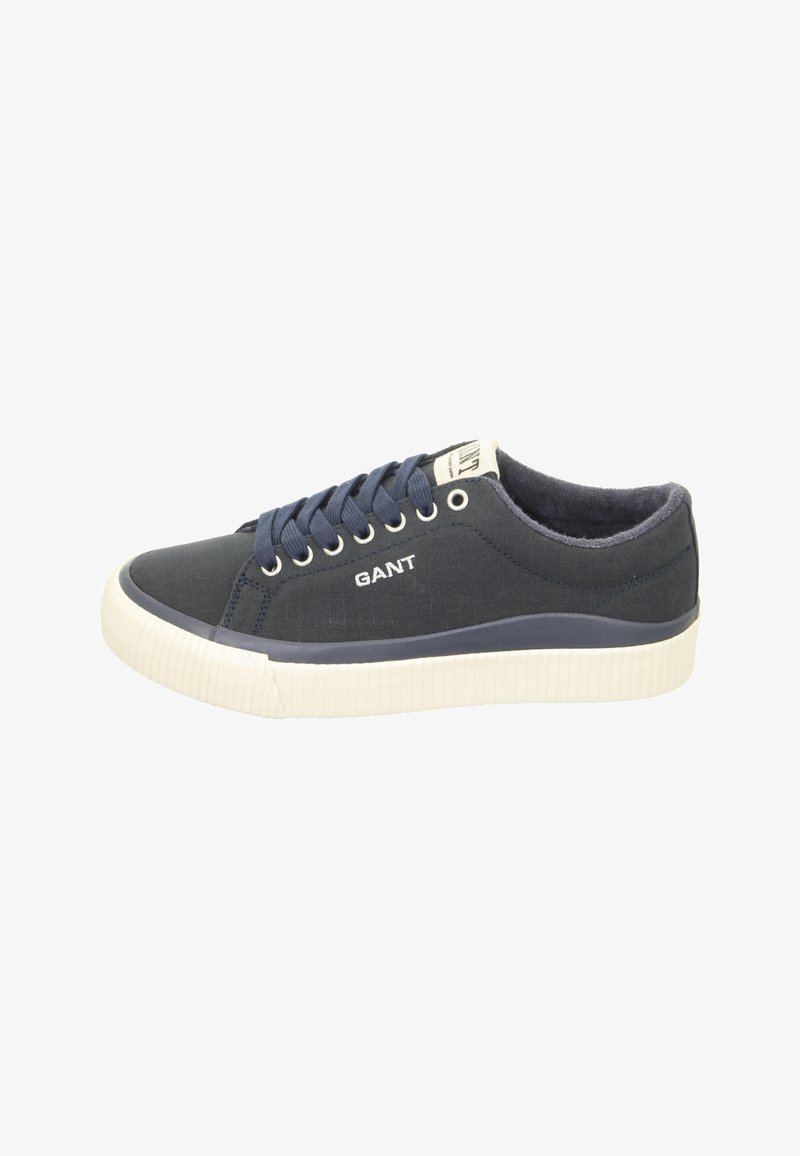 Navy canvas sneakers with white rubber sole, round toe, and blue laces. Features “GANT” logo on the side and textured surface.