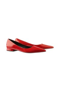 Red patent leather flats with a pointed toe and low block heel. The shoes feature a smooth texture and a minimalistic design.
