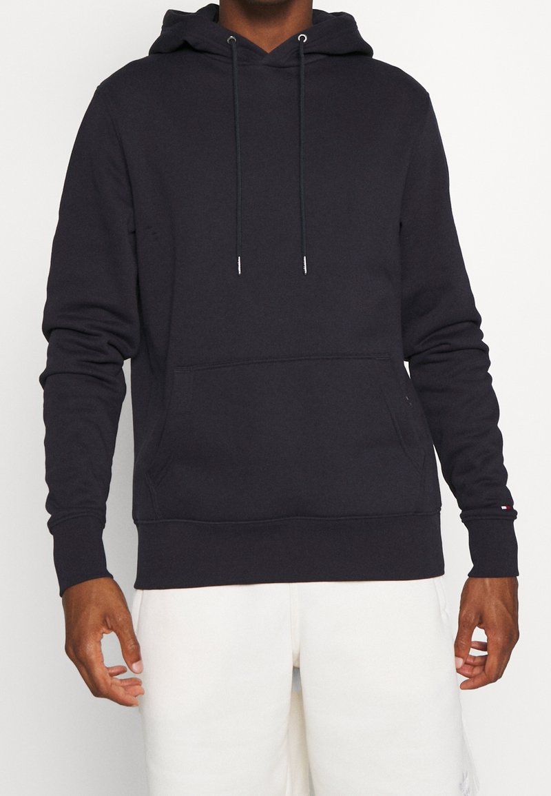 Dunkelgrauer Kapuzenpulli aus Baumwollmischung, mit Kängurutasche, verstellbaren Kordeln, gerippten Bündchen und lässiger Passform.