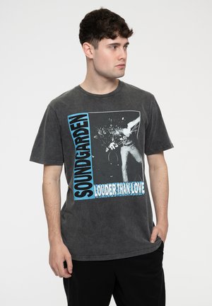 Gray cotton t-shirt featuring a large graphic print of a band with "SOUNDGARDEN LOUDER THAN LOVE" text in blue and black accents.