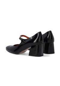 Black patent leather Mary Jane shoes with a wide block heel, round toe, and adjustable strap featuring a small metallic buckle detail.