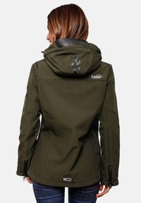 Woman facing away wearing an olive green hooded softshell jacket with Marikoo Mountain logos on back and sleeve.