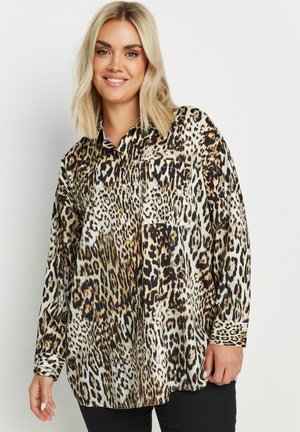 Leopard print blouse in silky fabric, featuring a collar, button-up front, long sleeves, and a patch pocket on the left.