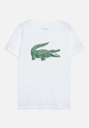 Wit T-shirt met korte mouwen met een grote groene krokodillenafbeelding in het midden van de borst, ronde hals.