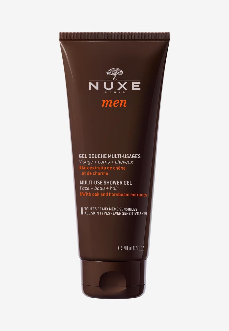 Tube marron de gel douche multi-usage NUXE Men pour le visage, le corps et les cheveux, avec des extraits de chêne et de charme, 200 ml.