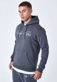 Sudadera con capucha gris y bolsillo frontal, con letras blancas que dicen "Project x Paris", puños acanalados y un corte relajado.