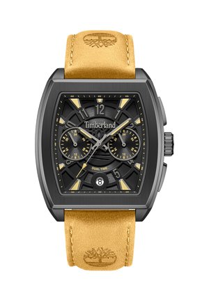 Zegarek Timberland na nadgarstek z czarną kwadratową tarczą, dwoma podtarczami czasu oraz okienkiem daty na godzinie 6, z beżowym skórzanym paskiem wytłoczonym logo Timberland.