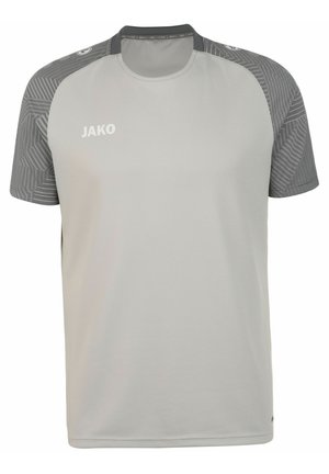 Lichtgrijze sport T-shirt met korte mouwen, voorzien van een gestructureerd donkergrijs patroon op de schouders en een witte JAKO-logo op de voorkant.