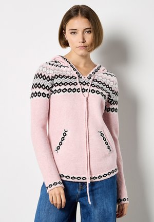 Sweatshirt à capuche rose clair avec des motifs géométriques en noir et blanc, comportant un cordon de serrage, deux poches avant et une texture douce.