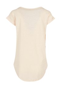 Light beige short-sleeve shirt with a relaxed fit, rounded hem, and soft, textured fabric. Simple and minimal design without patterns.