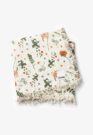 Blandingstæppe med blomster mønster i grøn og koral på en crème baggrund. Kanterne har frynset detaljering. Etiket med teksten "Elodie."