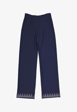 Pantalon large bleu marine avec une taille haute et de petits motifs triangulaires blancs le long de l'ourlet inférieur.