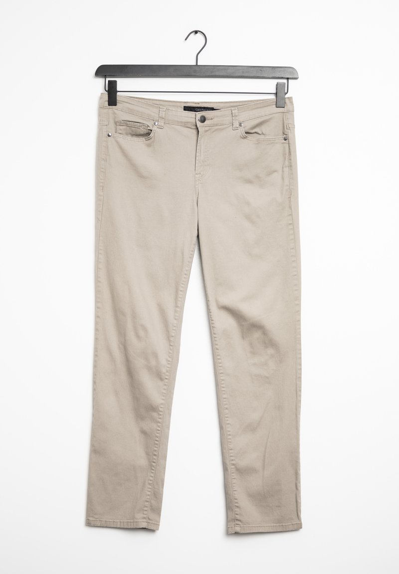 Beige cotton pants with a straight-cut design, featuring pockets and a button closure. Fabric has a smooth texture and minimal stitching details.