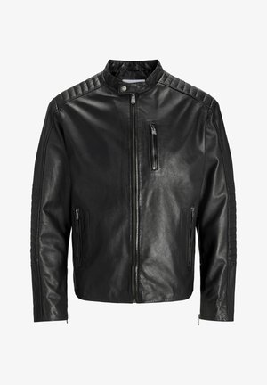 Must must nahkjope, millel on seisev krae, lukuga esikülg ja kaks küljetaskut. Õlgadel ja varrukatel on ribakujuline tekstuur.