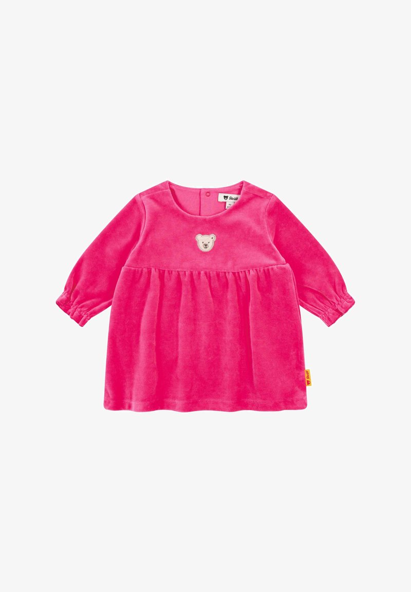 Robe en velours rose avec des manches longues, un col rond et une broderie de nounours sur la poitrine. Design évasé avec des poignets élastiques.