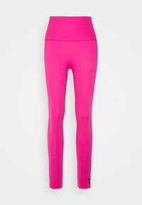 Leggings aderenti a vita alta di un vivace colore rosa, realizzati in un tessuto elastico e liscio. Presentano una texture a coste sui polsini e un piccolo dettaglio con logo.