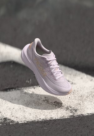 Light purple running shoe featuring a breathable mesh upper, cushioned sole, and reflective HOKA logo. Accented with peach details.