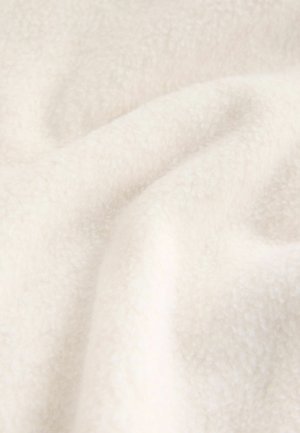 White fleece fabric with a soft, textured surface, showing gentle folds and creases, highlighting its pliable and cozy appearance.