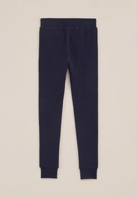 Navy blue leggings made of soft fabric, featuring a snug fit, tapered legs, and elastic waistband with no additional patterns or accents.