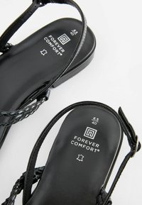 Next FOREVER COMFORTÂ® LEATHER FLAT TUBULAR PLAITED SANDALS - Sandalen - black