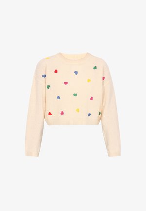 Kremowy, krótki sweter z długimi rękawami, ozdobiony rozsianymi wielokolorowymi motywami serc w odcieniach czerwonym, zielonym, niebieskim, żółtym i różowym.